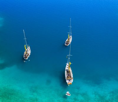 Yachts in the bay near the green island. Summer vacation, Greece, Kefalonia
